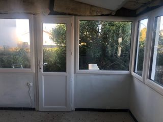 Rénovation véranda PVC blanc avec fenêtres