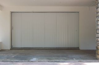 Rénovation porte garage sectionnelle latérale TRYBA AMN
