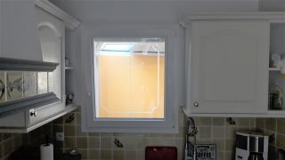 Fenêtre PVC oscillo-battant avec vitrage ornemental